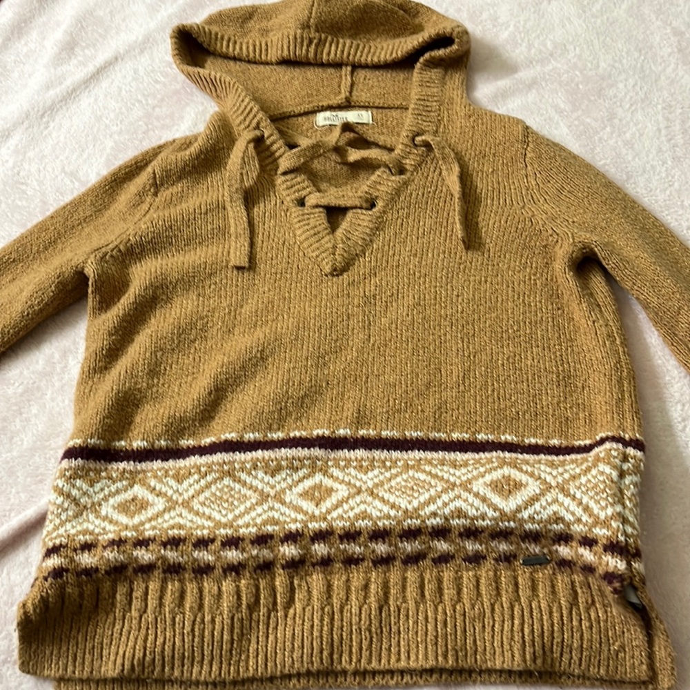 Hollister sweater with patterned front and hoodie.